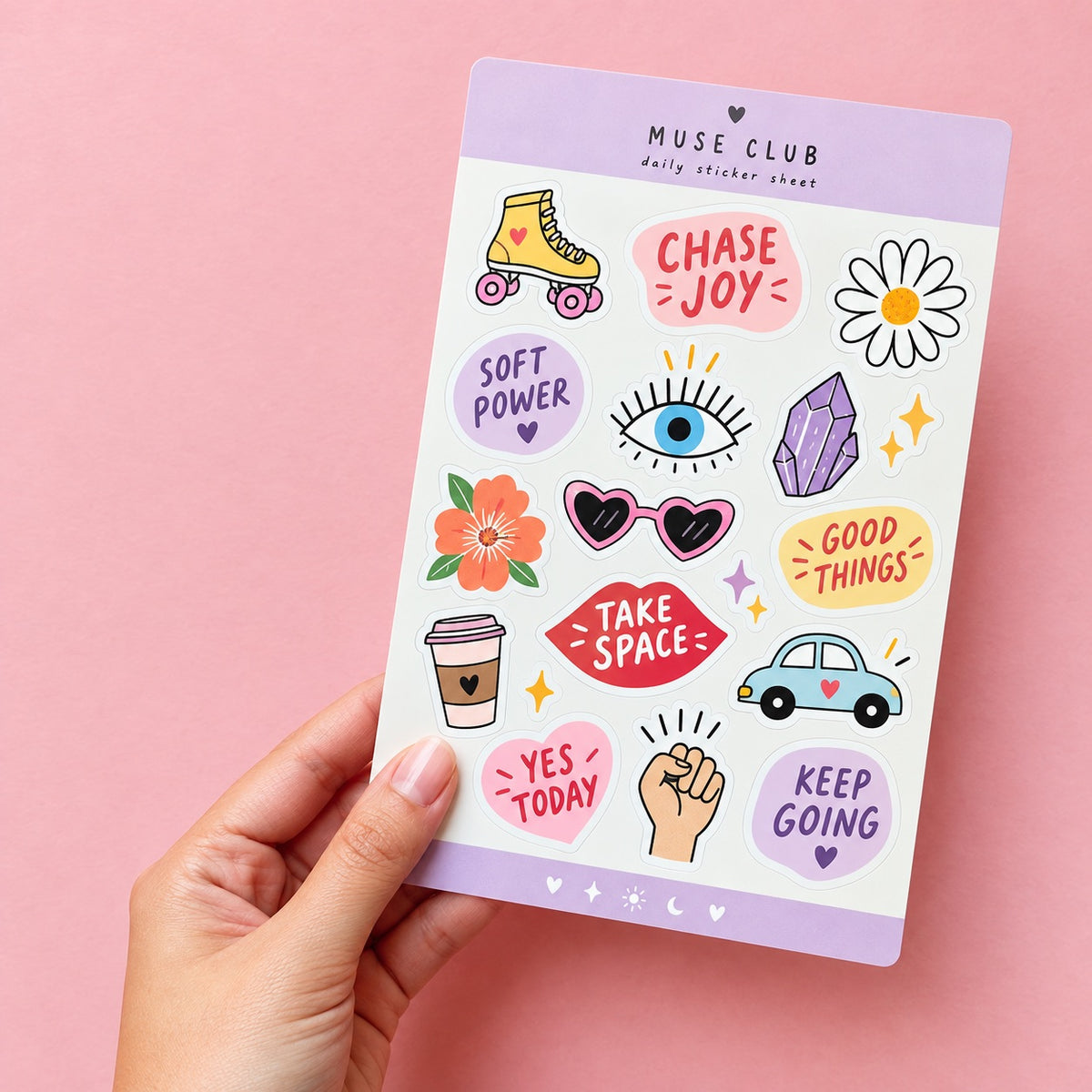 Hand holding a colorful custom daily planner sticker sheet with roller skate, flower, coffee, car, and motivational designs.