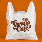 Custom printed eco friendly plastic grocery bag with cafe logo and reusable takeout packaging detail
