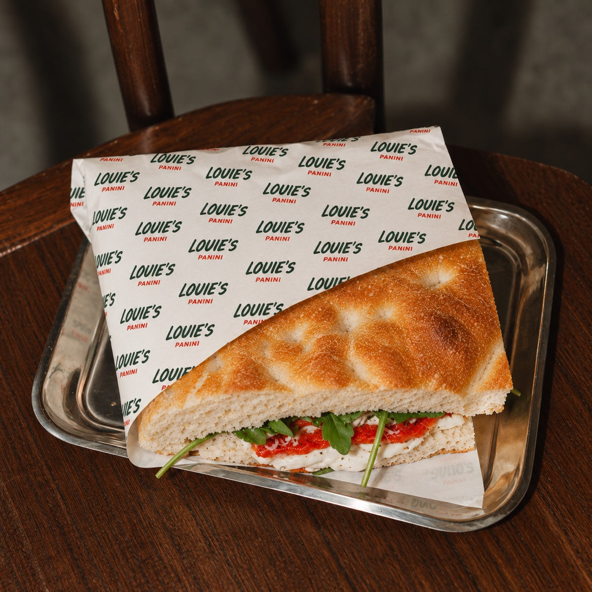 Custom printed food wrapping paper with cafe branding for sandwiches and deli packaging