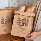Custom printed kraft paper food bag sample showing logo print and folded paper construction