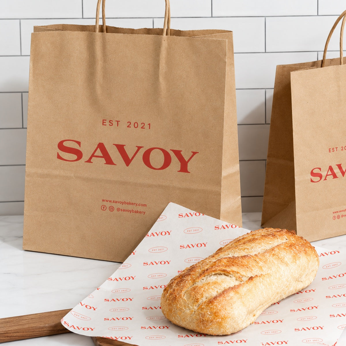 Custom printed kraft paper takeout bags with bakery branding and recyclable food packaging detail