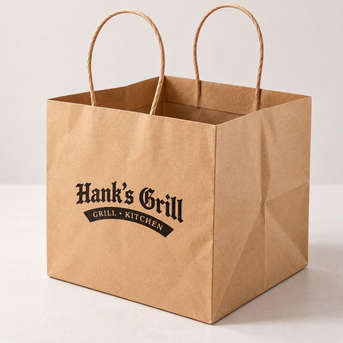 Custom printed kraft paper takeout bag with restaurant branding for food service packaging
