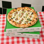 Custom pizza boxes with full color printed branding for pizzeria takeout packaging