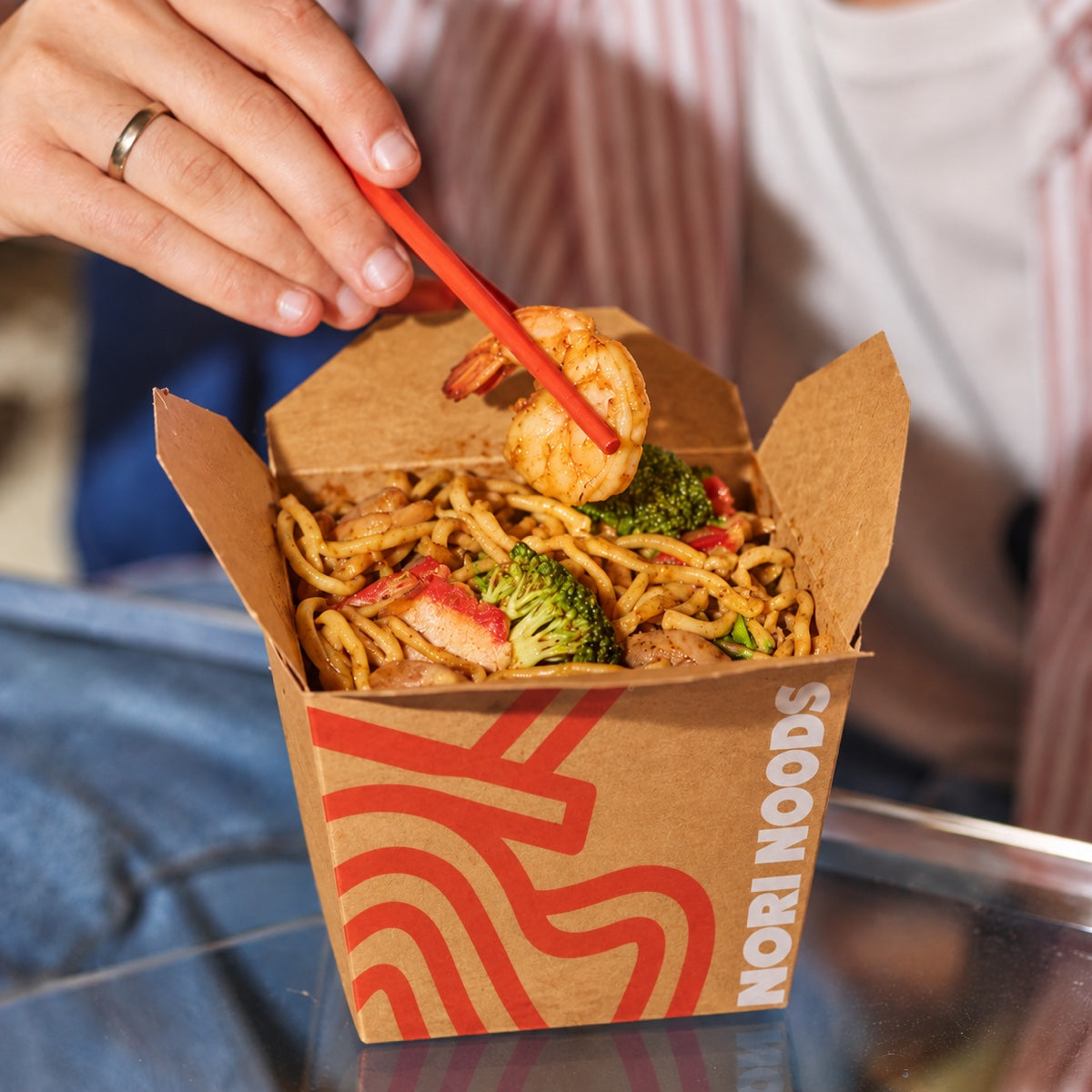 Custom printed square noodle box sample with chopsticks and branded takeout packaging detail