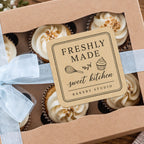 Custom kraft rounded corner bakery label applied to a ribbon-wrapped cupcake gift box.