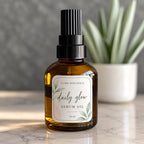 Custom botanical rounded corner product label applied to an amber glass serum oil bottle.